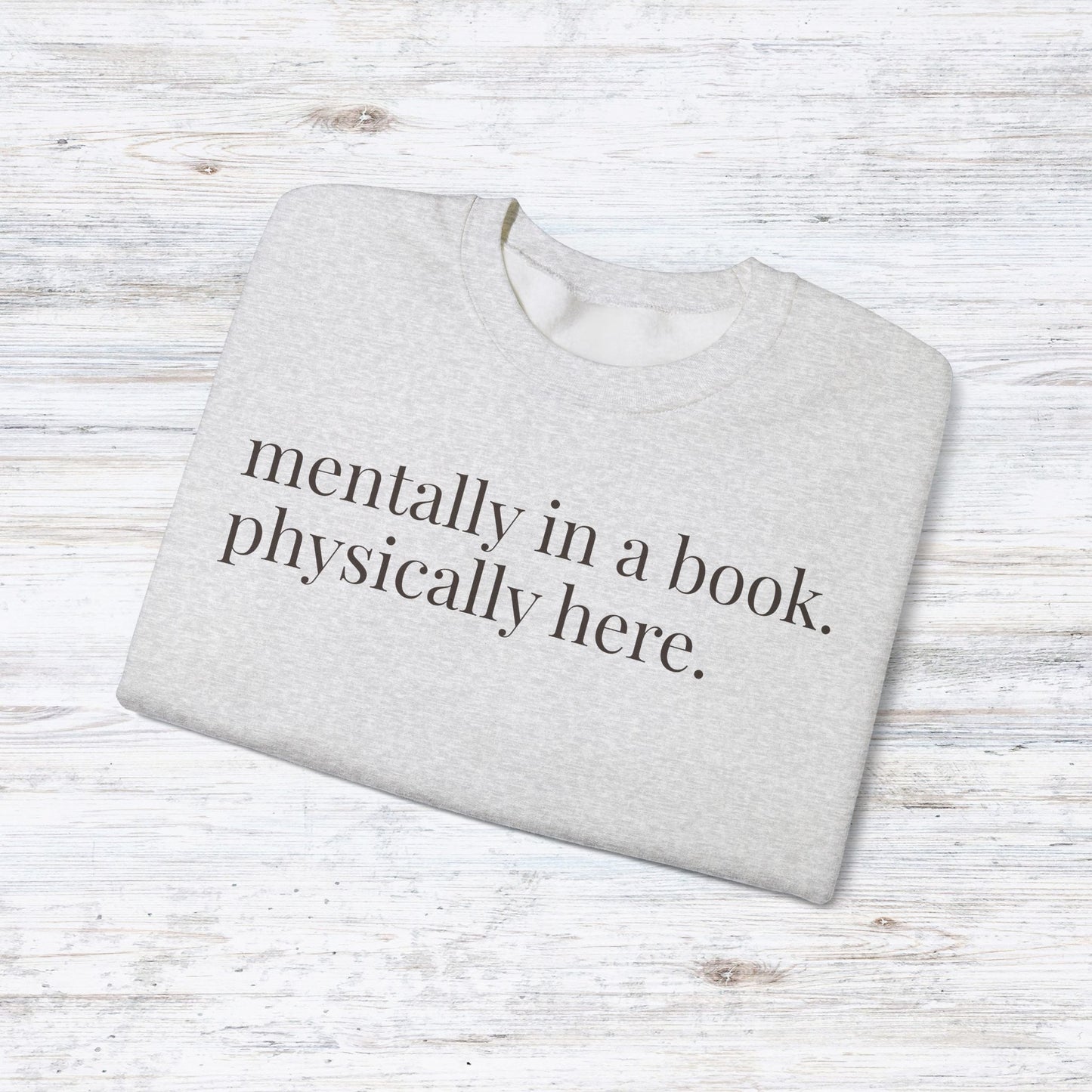 mentally in a book. physically here. | reader core crewneck